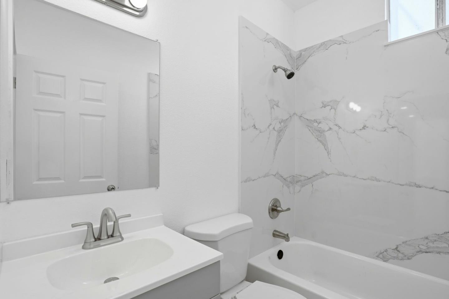 345 South Pilgrim Street Stockton, CA 95205 - Photo 19 of 27 a bathroom with a sink a toilet and shower