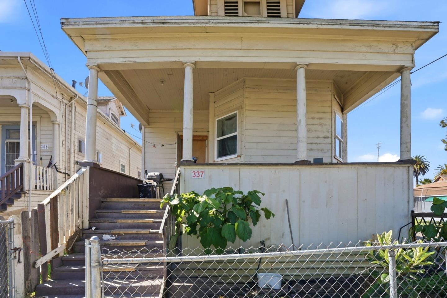 345 South Pilgrim Street Stockton, CA 95205 - Photo 23 of 27 a view of house with wooden fence and potted plants