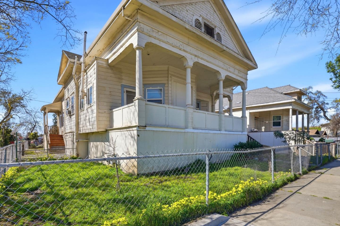 345 South Pilgrim Street Stockton, CA 95205 - Photo 3 of 27 a view of a house with a yard