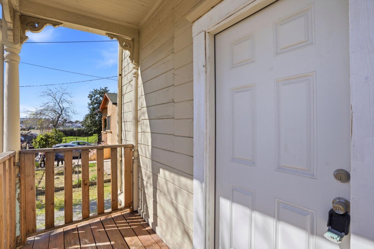 345 South Pilgrim Street Stockton, CA 95205 - Photo 5 of 27 a view of a balcony with wooden floor and iron fence