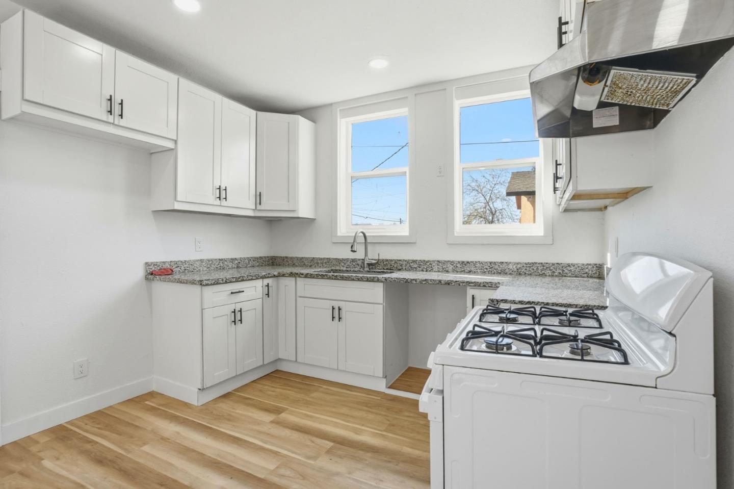 345 South Pilgrim Street Stockton, CA 95205 - Photo 8 of 27 a kitchen with stainless steel appliances granite countertop a sink stove and cabinets