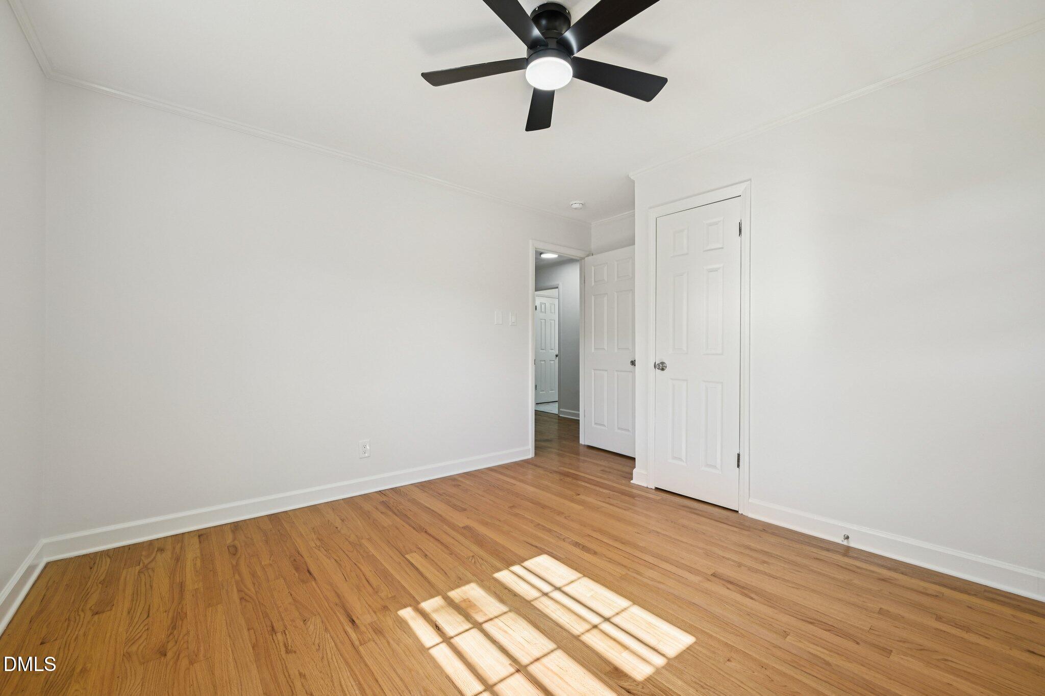 515 Uzzle Street Durham, NC 27713 - Photo 16 of 26 a view of a room with wooden floor and white walls