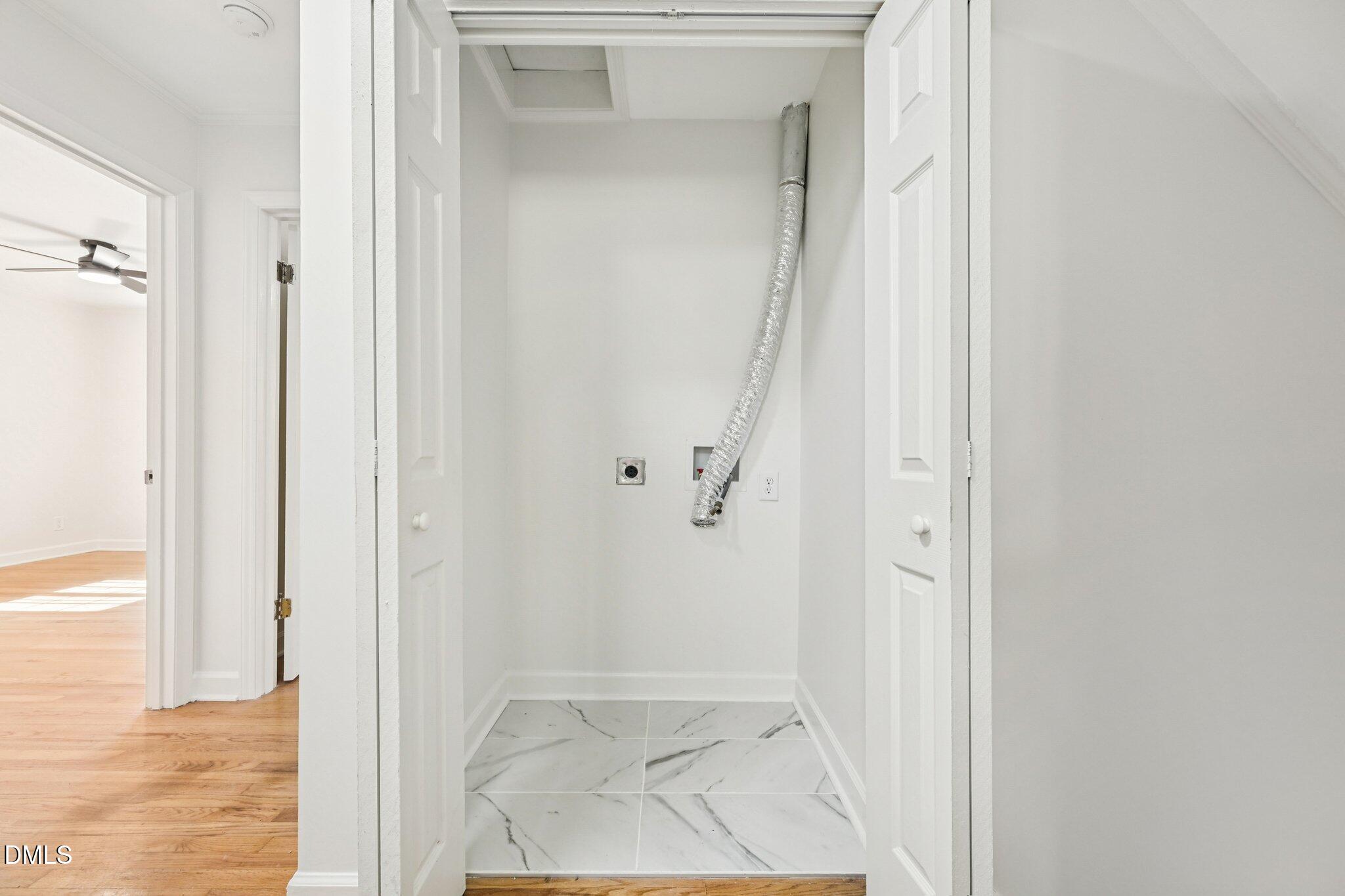 515 Uzzle Street Durham, NC 27713 - Photo 19 of 26 a view of a bathroom from a hallway