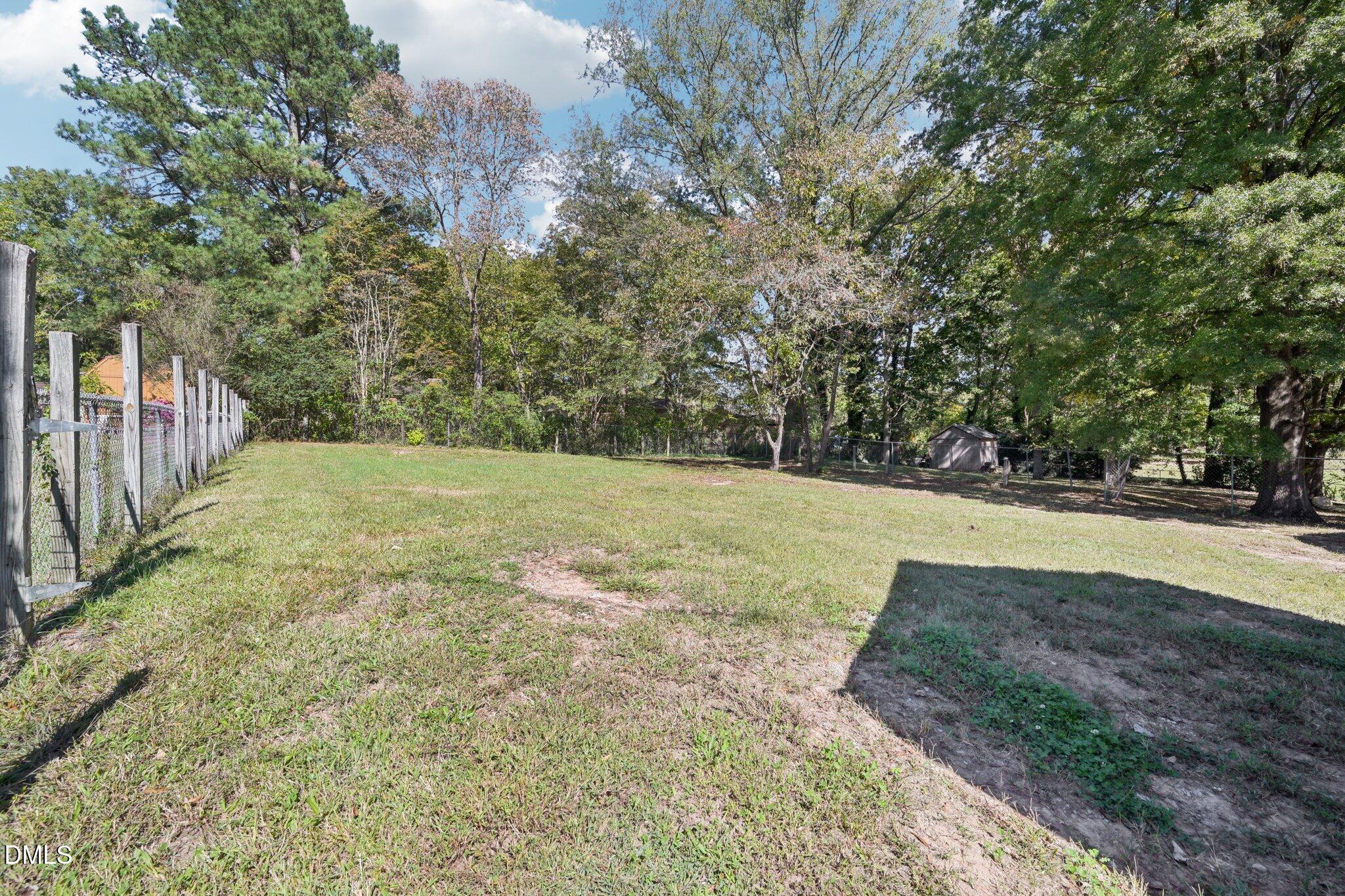 515 Uzzle Street Durham, NC 27713 - Photo 26 of 26 a view of a yard with an trees