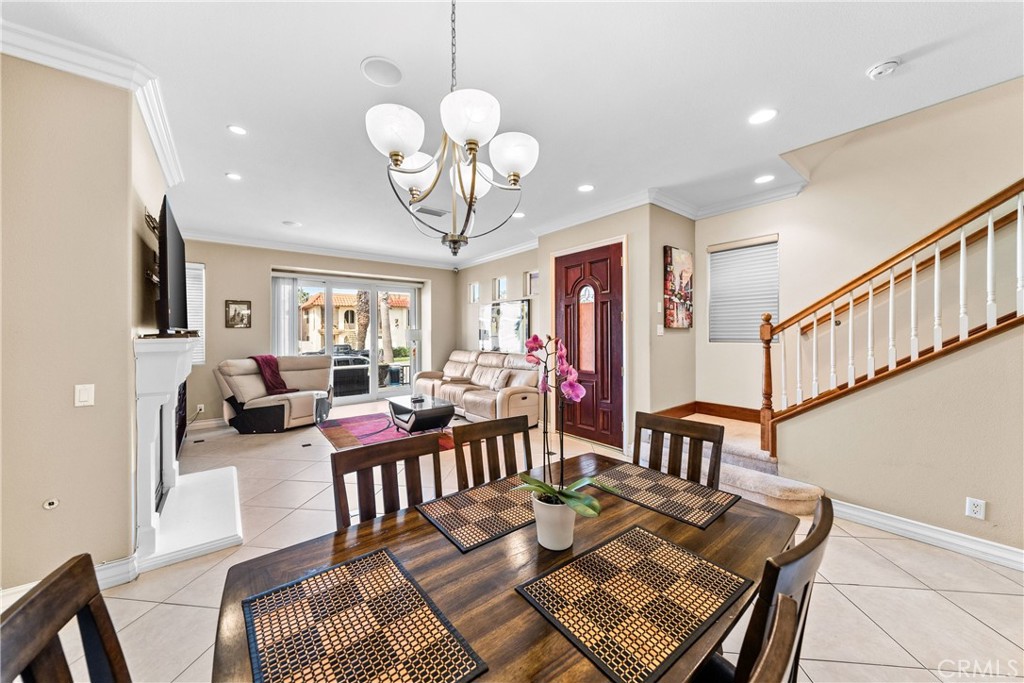 116 11th Street Huntington Beach, CA 92648 - Photo 11 of 28 a view of a dining room with furniture a rug and wooden floor