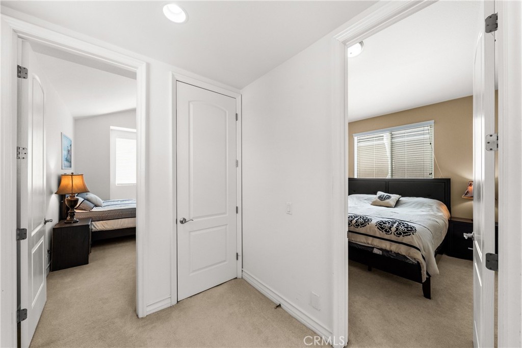 116 11th Street Huntington Beach, CA 92648 - Photo 16 of 28 a bedroom with a bed and a couch