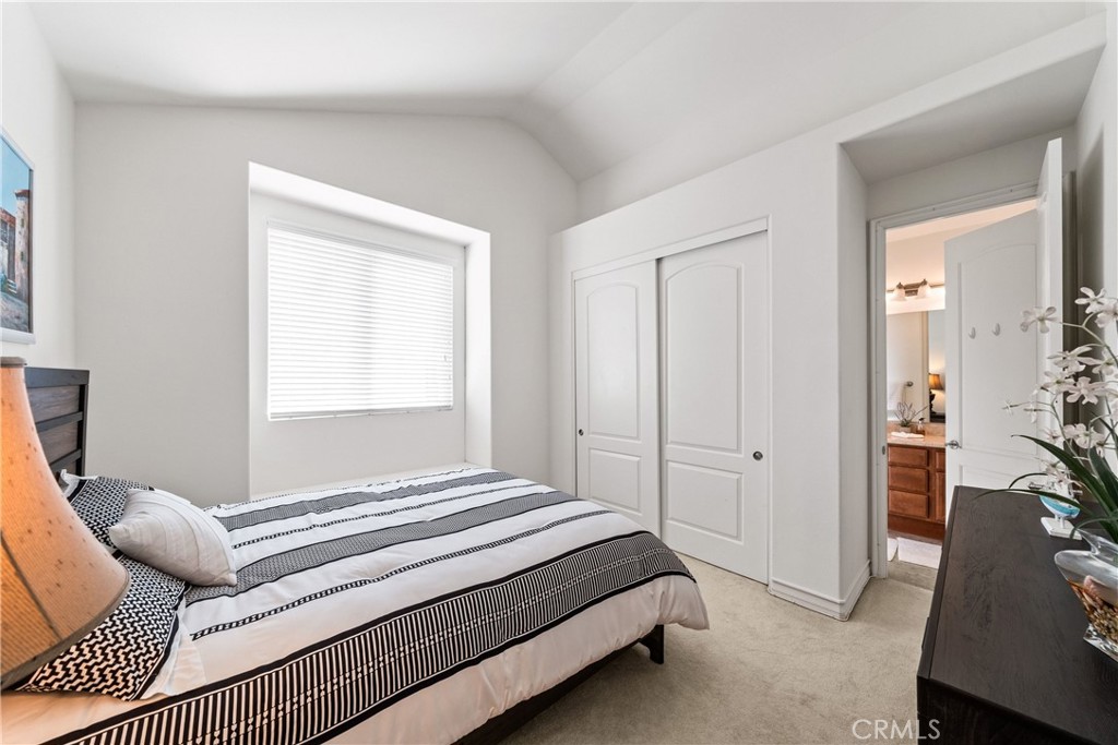 116 11th Street Huntington Beach, CA 92648 - Photo 18 of 28 a bedroom with a bed and a window
