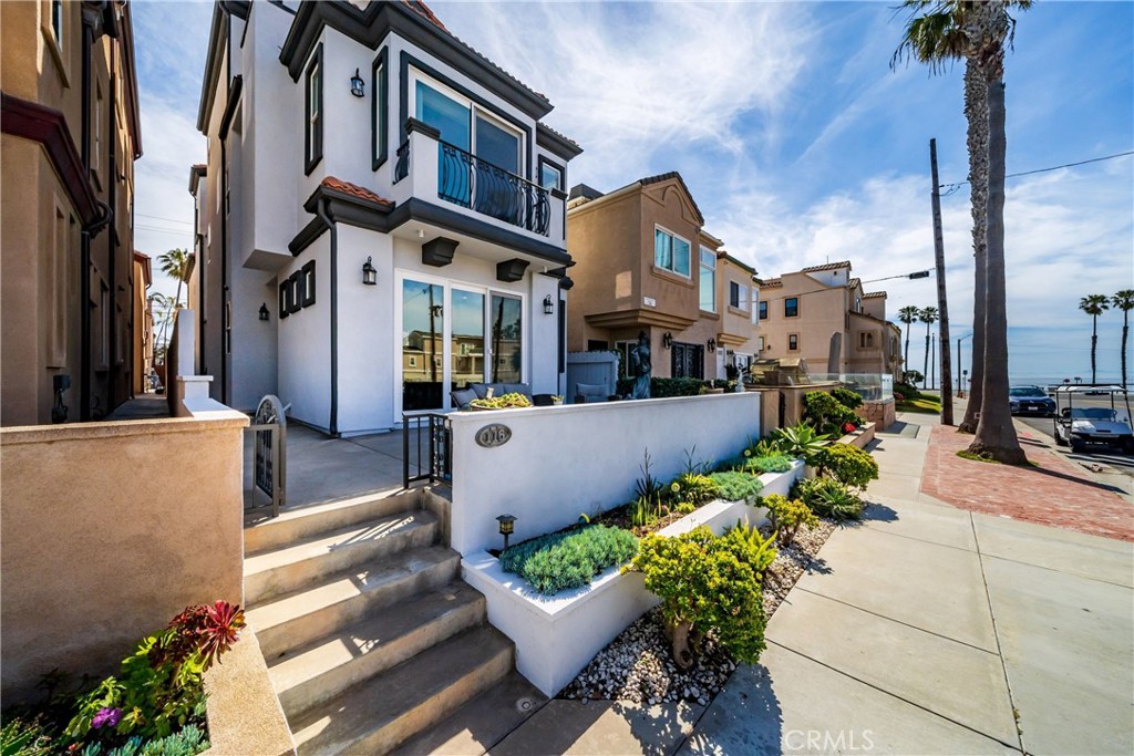 116 11th Street Huntington Beach, CA 92648 - Photo 5 of 28 a view of a patio with couches and potted plants