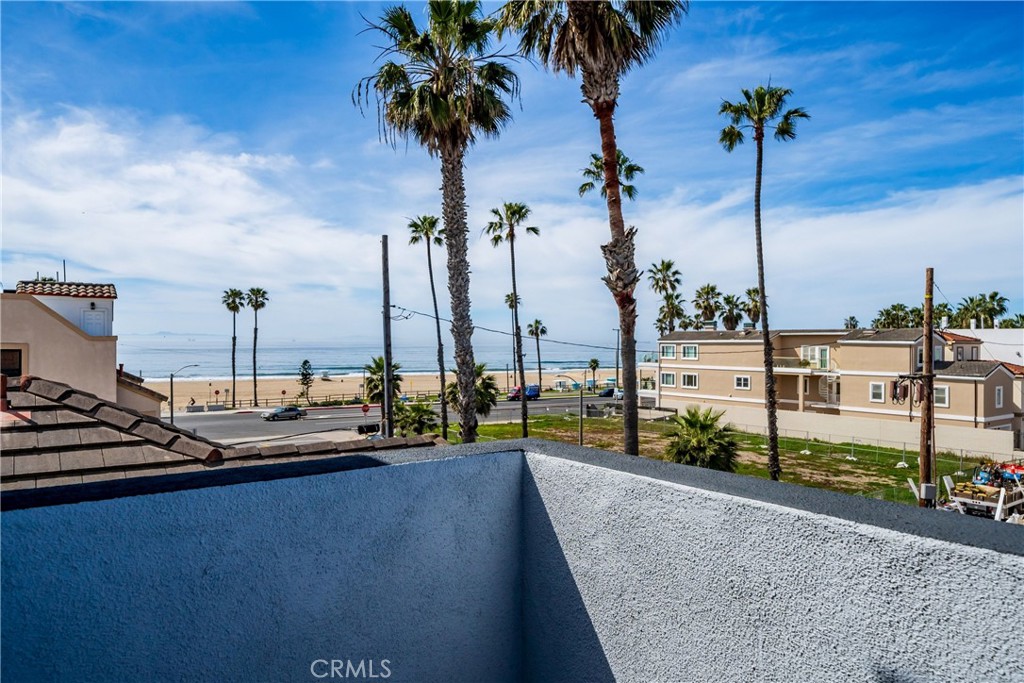 116 11th Street Huntington Beach, CA 92648 - Photo 9 of 28 a view of a lake with a palm and palm trees