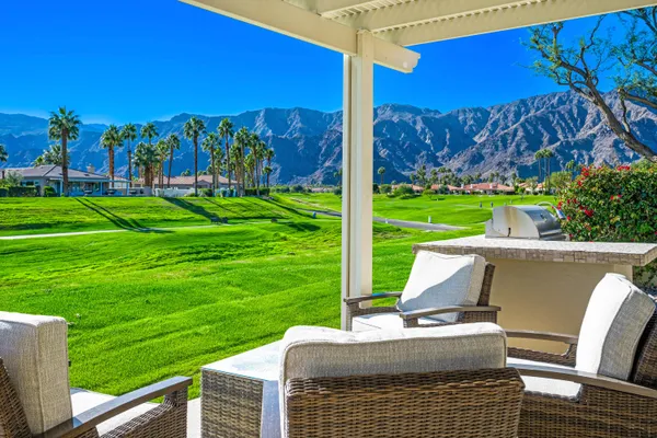 a view of a patio with a yard