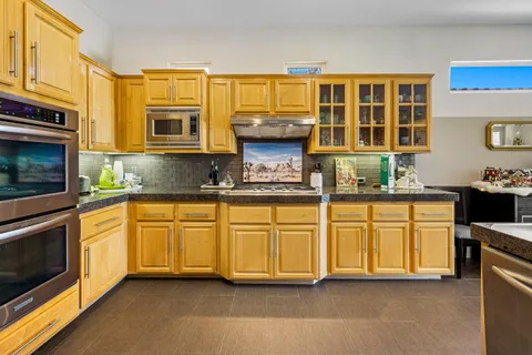 a room with furniture and flat screen tv