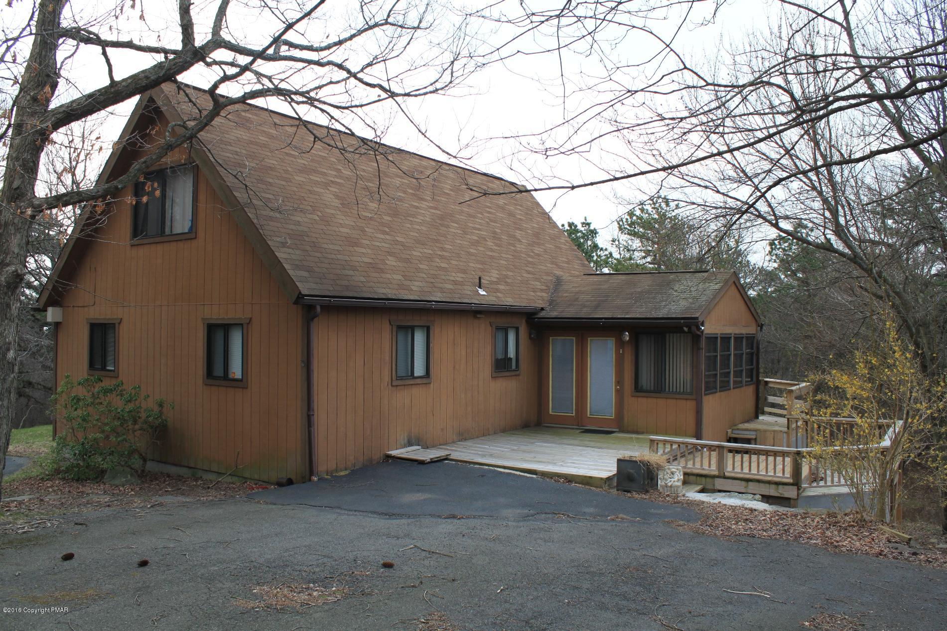a house with a tree in the background