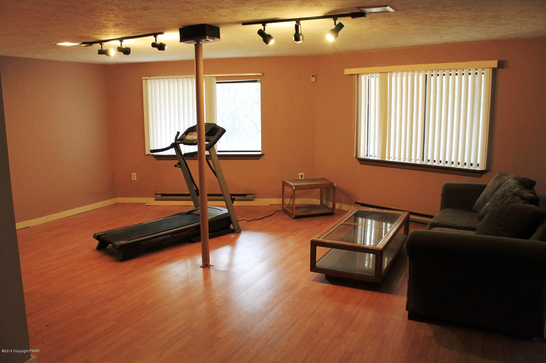 1421 Clover Road Long Pond, PA 18334 - Photo 19 of 26 a living room with furniture and a window
