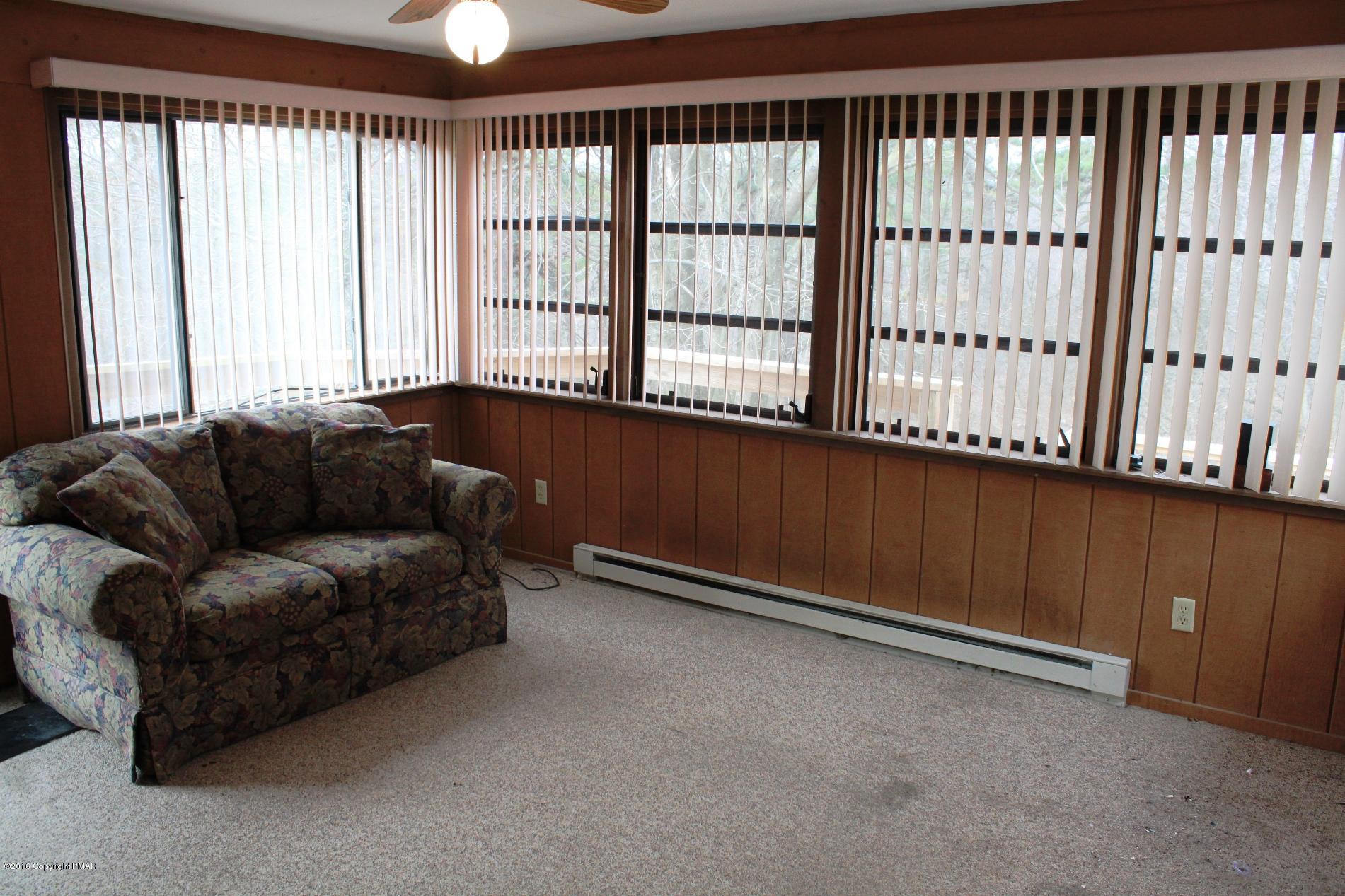 1421 Clover Road Long Pond, PA 18334 - Photo 3 of 26 a living room with furniture and a window