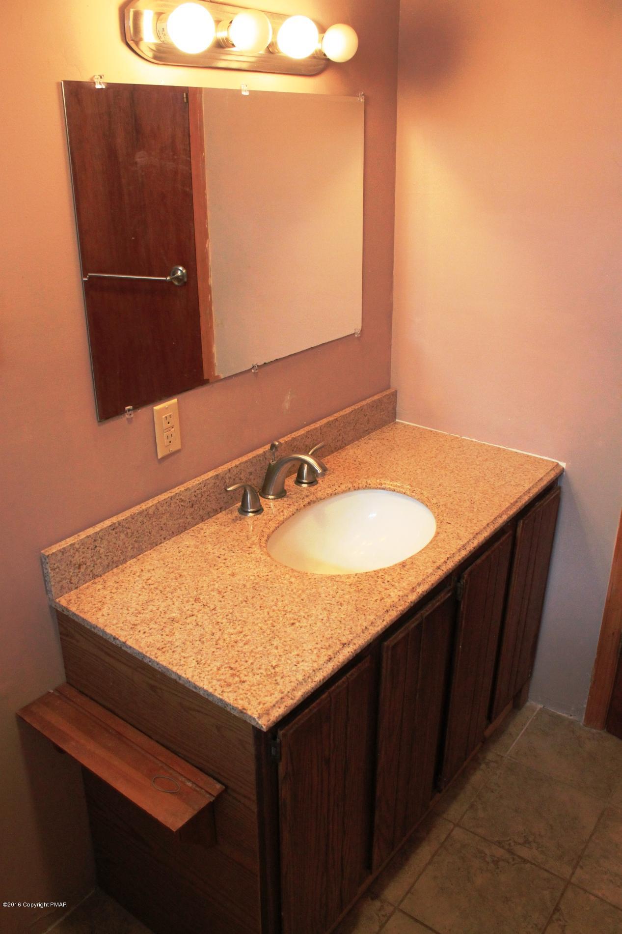 1421 Clover Road Long Pond, PA 18334 - Photo 9 of 26 a bathroom with a sink and a mirror