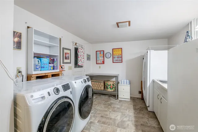 a view of livingroom with washer and dryer