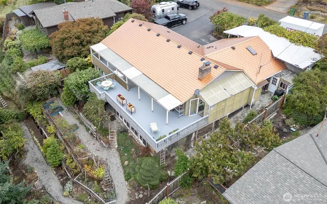 an aerial view of mountain with trees all around