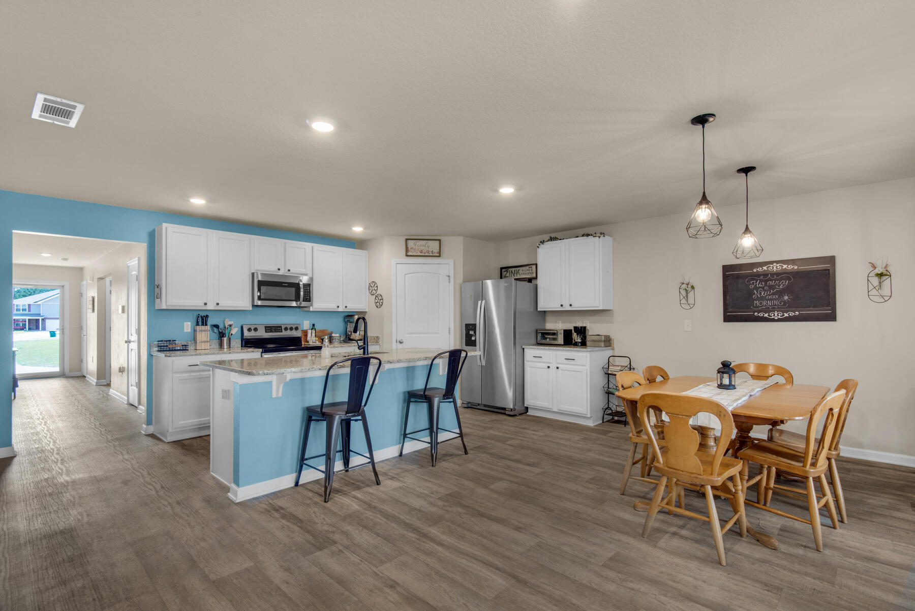 1016 Limpkin Street Crestview, FL 32539 - Photo 11 of 36 a view of kitchen with cabinets table and chairs