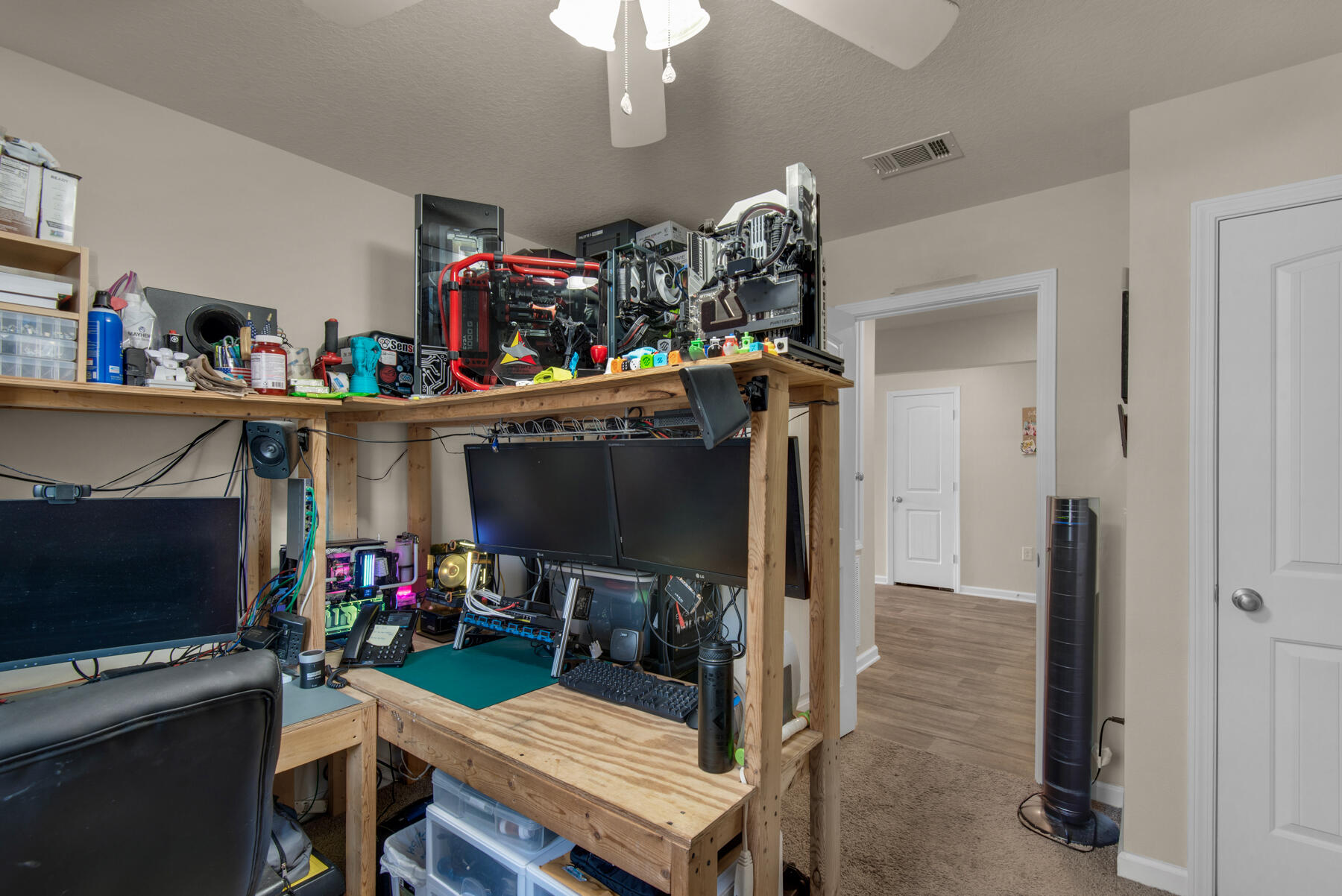 1016 Limpkin Street Crestview, FL 32539 - Photo 15 of 36 a living room with furniture a flat screen tv and a refrigerator