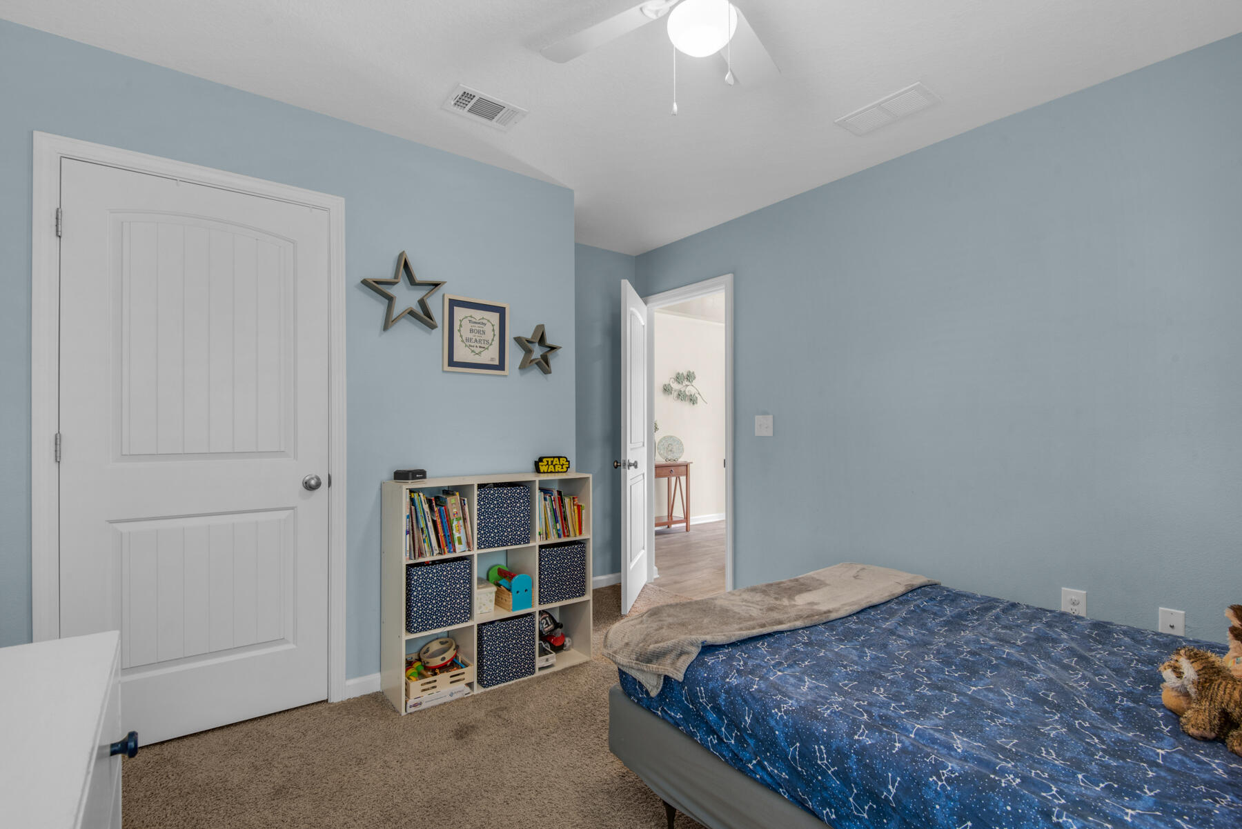 1016 Limpkin Street Crestview, FL 32539 - Photo 17 of 36 a bedroom with a bed and a cabinets