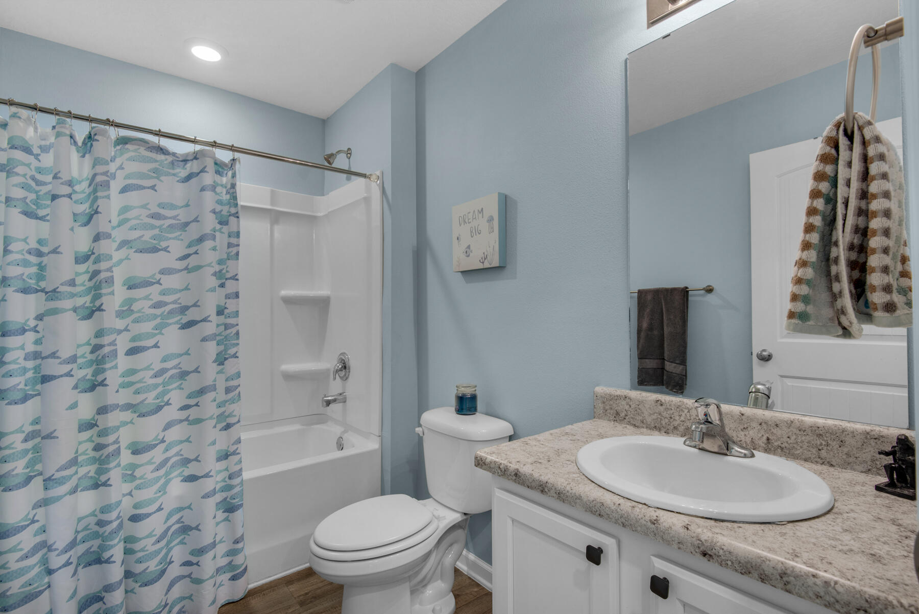 1016 Limpkin Street Crestview, FL 32539 - Photo 19 of 36 a bathroom with a granite countertop sink toilet and shower