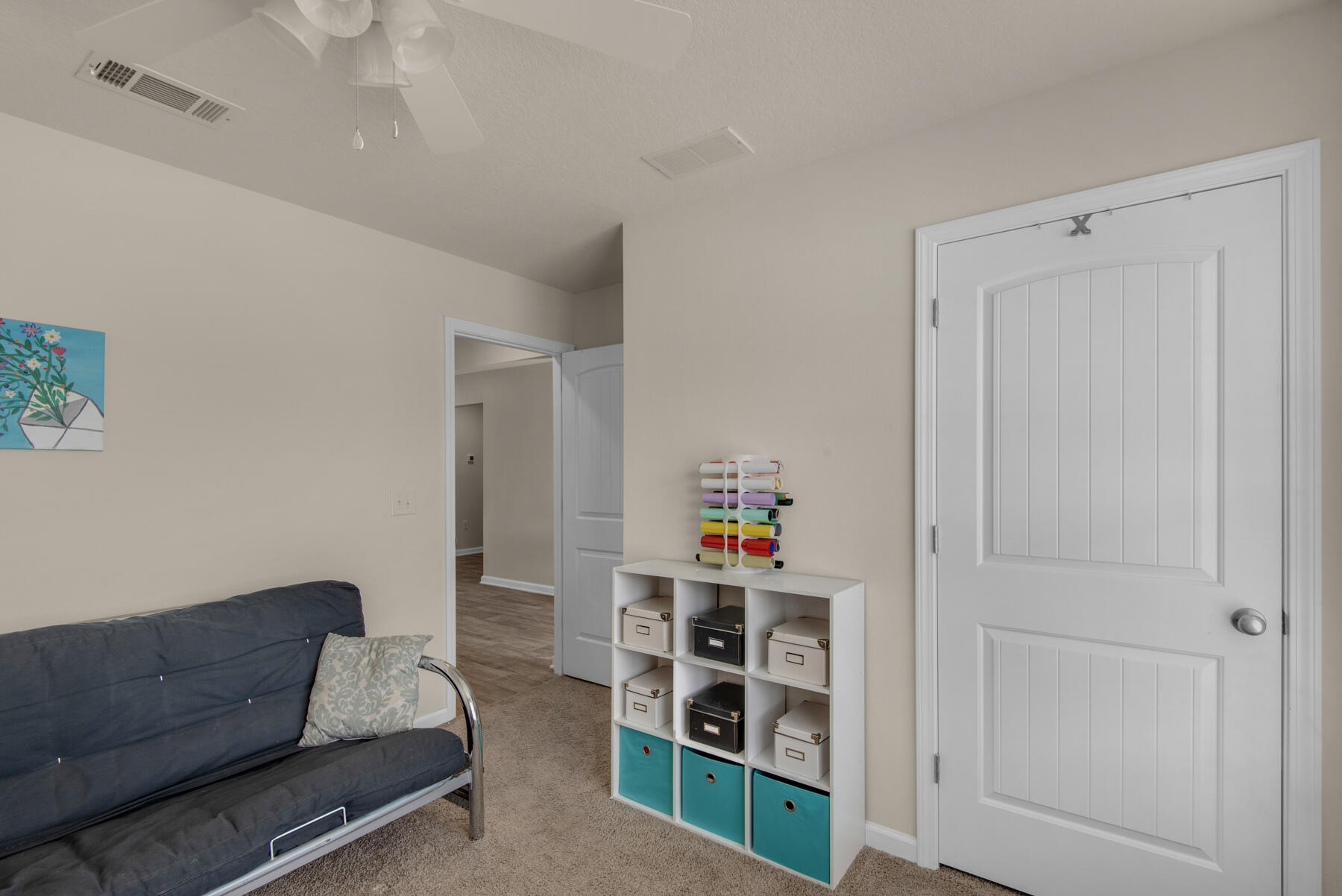 1016 Limpkin Street Crestview, FL 32539 - Photo 22 of 36 a living room with furniture and a window