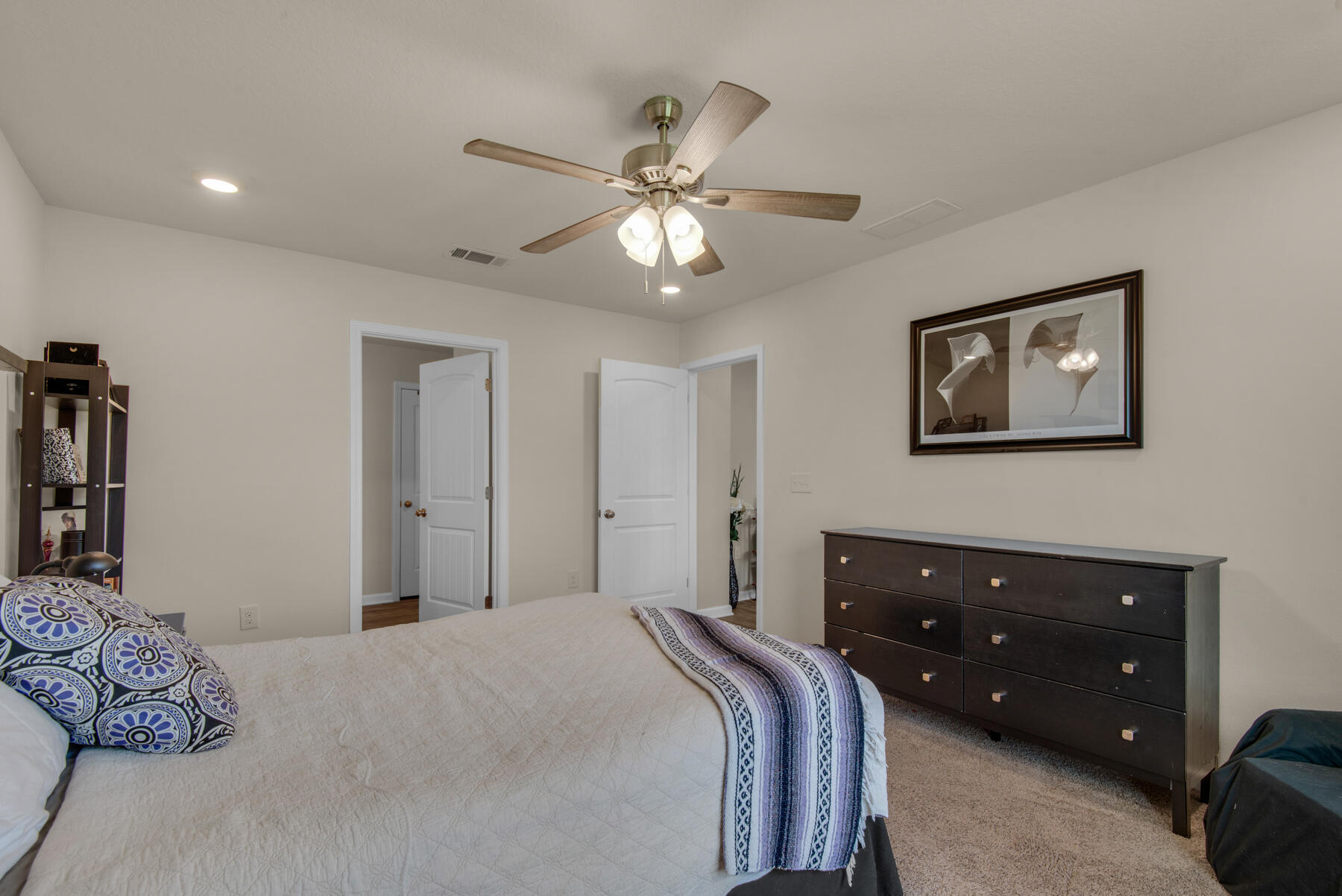 1016 Limpkin Street Crestview, FL 32539 - Photo 28 of 36 a bedroom with a bed and a chandelier