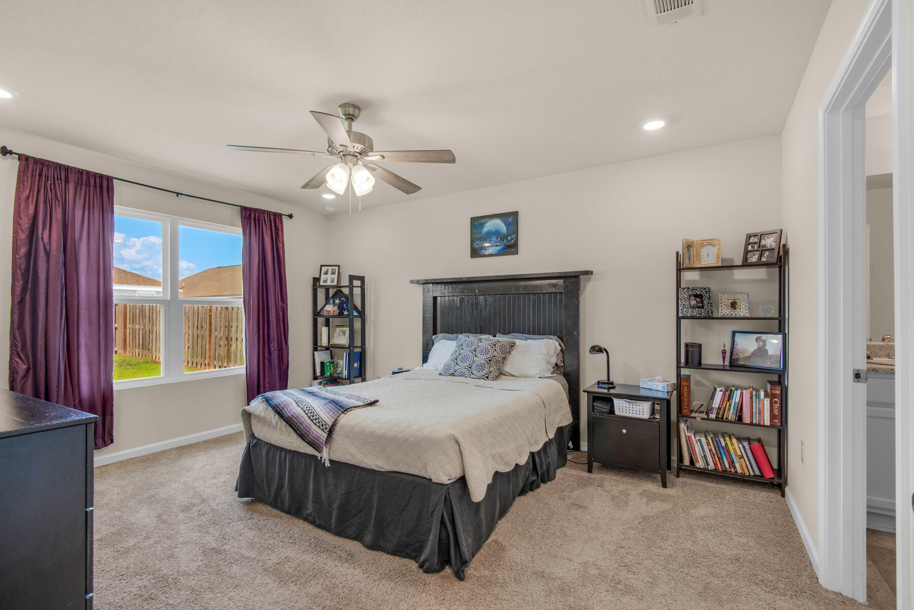 1016 Limpkin Street Crestview, FL 32539 - Photo 30 of 36 a bedroom with a bed furniture and a large window