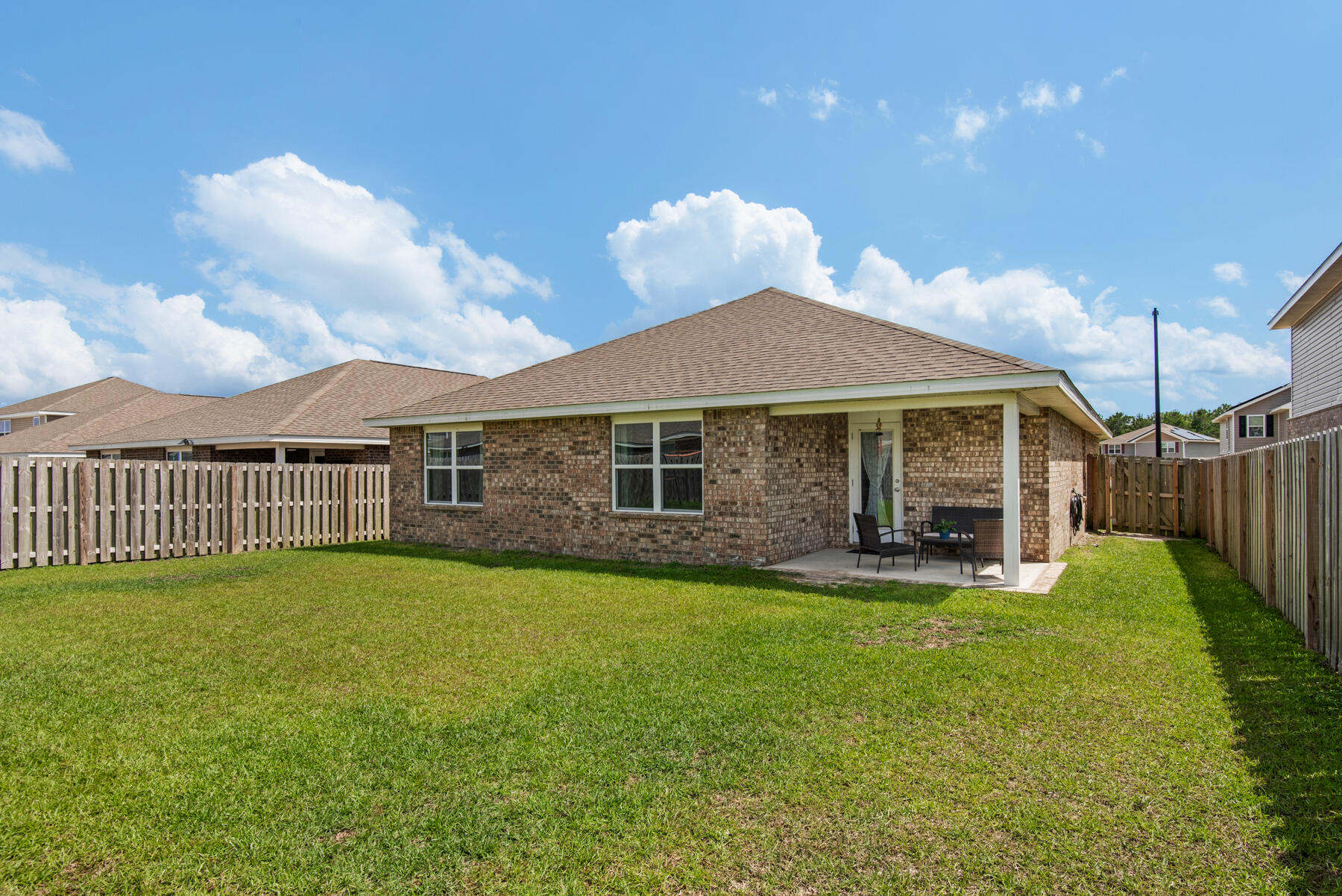 1016 Limpkin Street Crestview, FL 32539 - Photo 35 of 36 a front view of a house with a yard