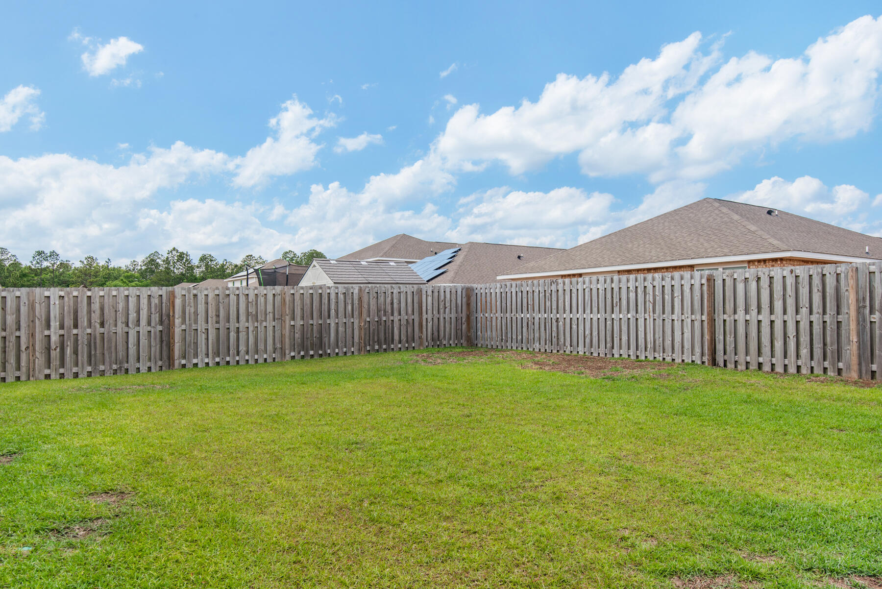 1016 Limpkin Street Crestview, FL 32539 - Photo 36 of 36 a view of a yard with wooden fence