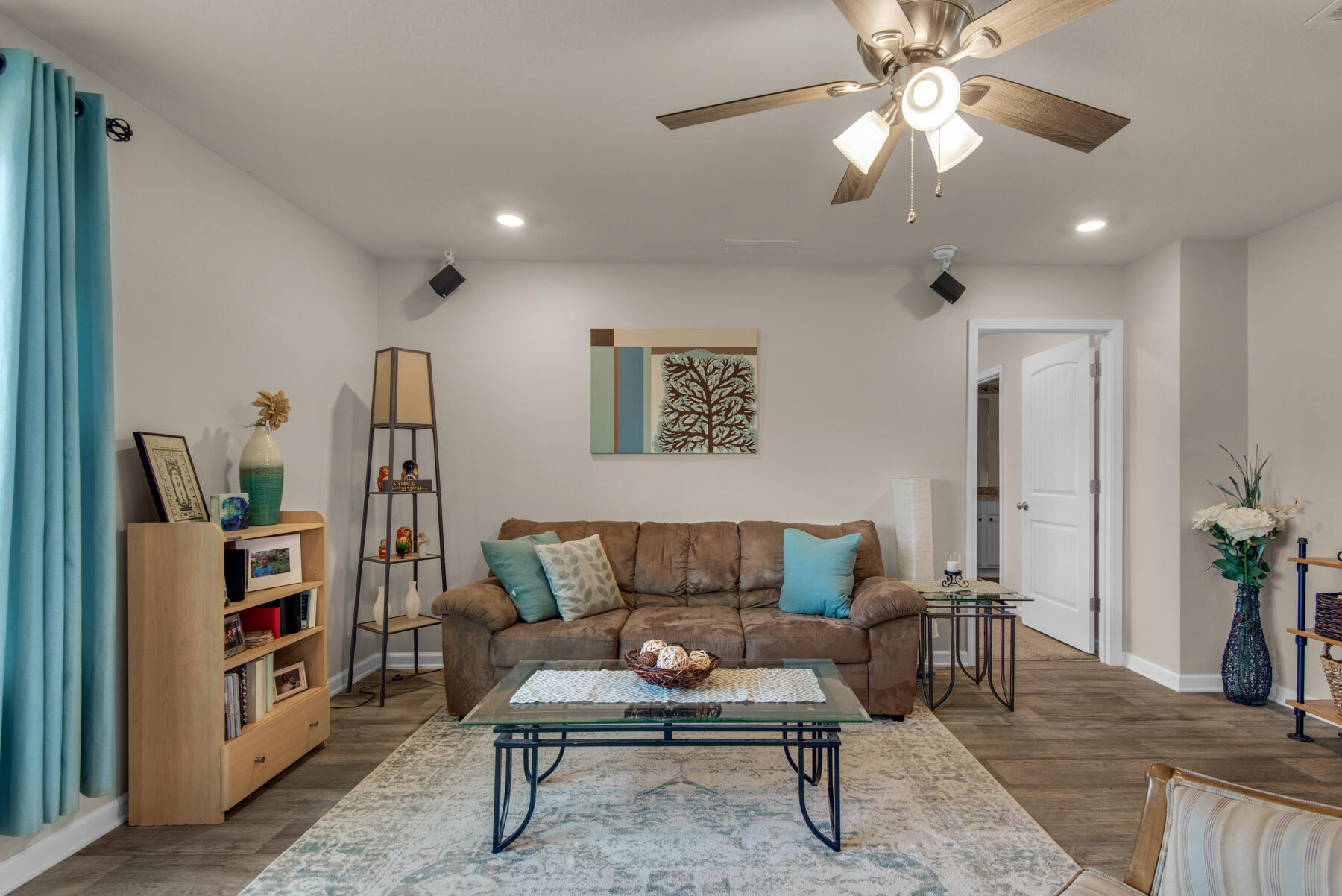 1016 Limpkin Street Crestview, FL 32539 - Photo 8 of 36 a living room with furniture and a chandelier