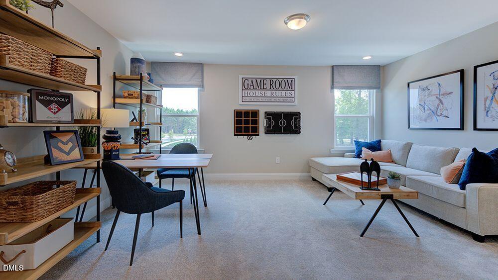 222 Tidal Pool Way Cary, NC 27519 - Photo 15 of 25 a living room with furniture and a painting on the wall