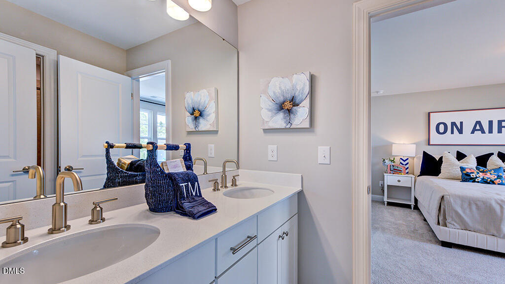 222 Tidal Pool Way Cary, NC 27519 - Photo 20 of 25 a bathroom with sink and mirror