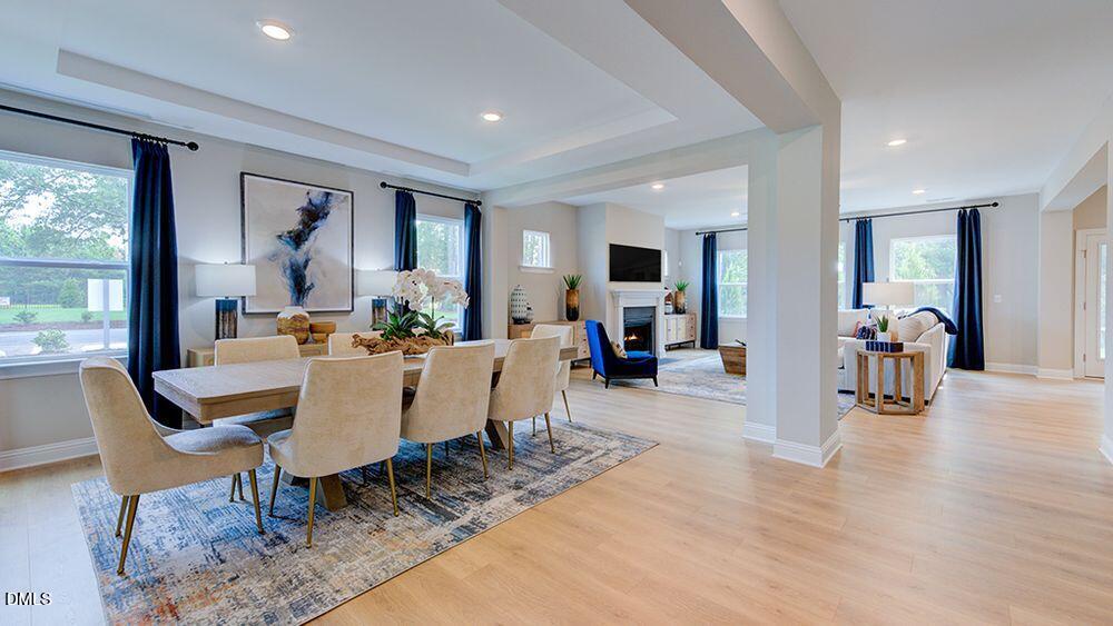 222 Tidal Pool Way Cary, NC 27519 - Photo 2 of 25 a view of a dining room with furniture window and wooden floor