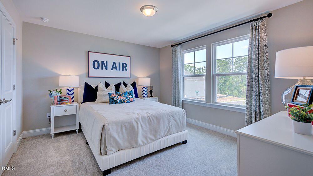 222 Tidal Pool Way Cary, NC 27519 - Photo 21 of 25 a bedroom with a bed and a window