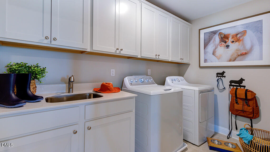 222 Tidal Pool Way Cary, NC 27519 - Photo 22 of 25 a kitchen with a sink and cabinets