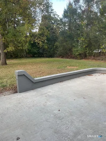 a view of swimming pool with a yard