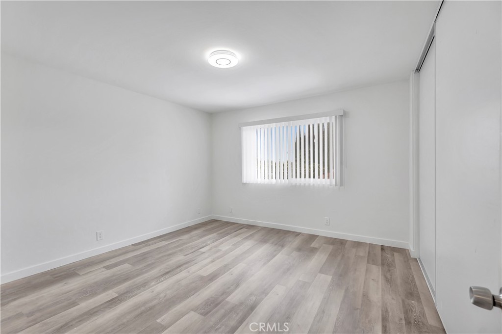 1813 West Ball Road Anaheim, CA 92804 - Photo 15 of 36 wooden floor in an empty room with a window