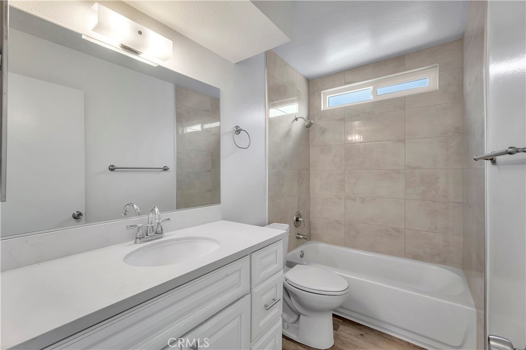 1813 West Ball Road Anaheim, CA 92804 - Photo 17 of 36 a bathroom with a sink a toilet and shower