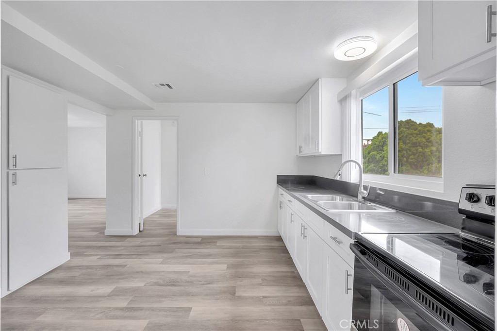 1813 West Ball Road Anaheim, CA 92804 - Photo 19 of 36 a kitchen with a sink and large window