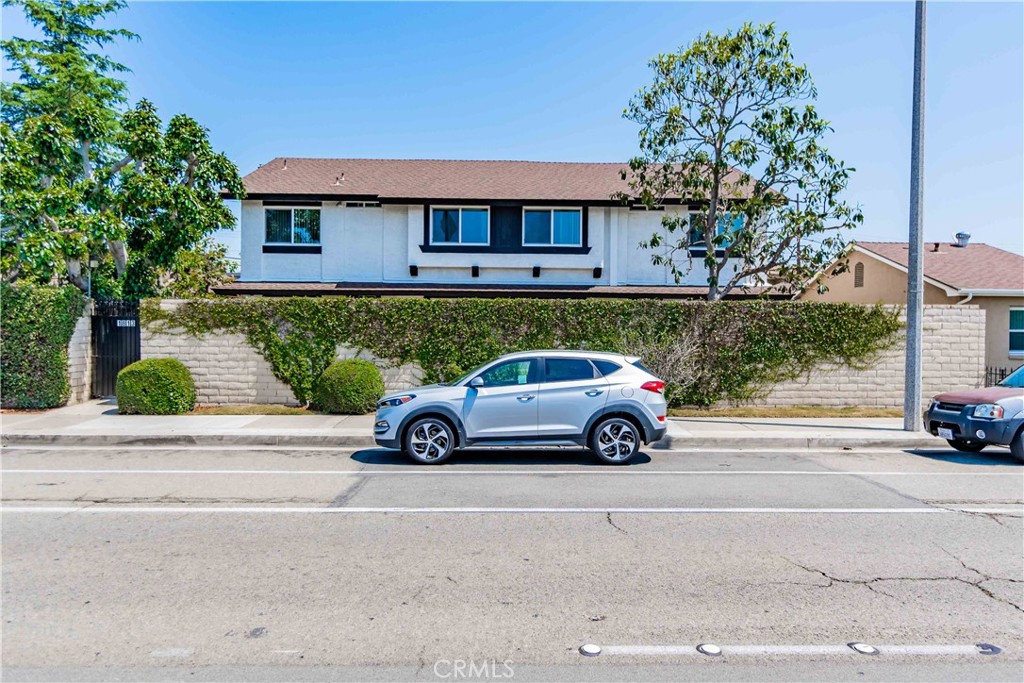 1813 West Ball Road Anaheim, CA 92804 - Photo 2 of 36 front view of a car parked in front of a house