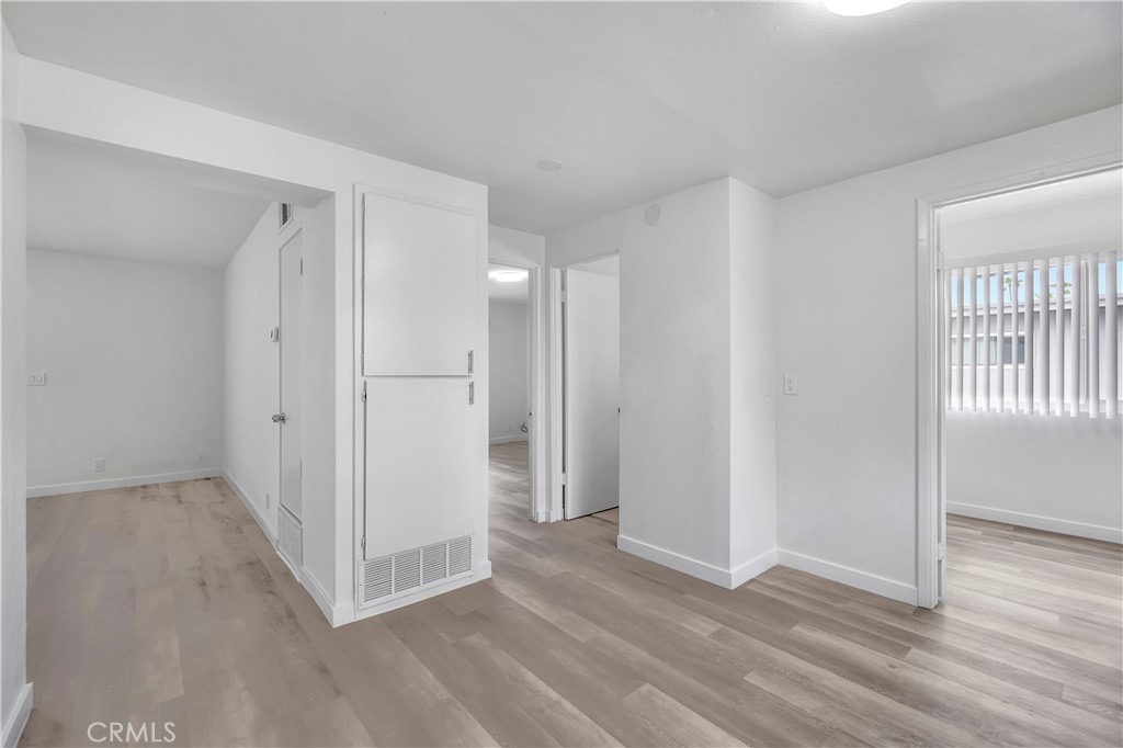 1813 West Ball Road Anaheim, CA 92804 - Photo 23 of 36 a view of an empty room with wooden floor and a window