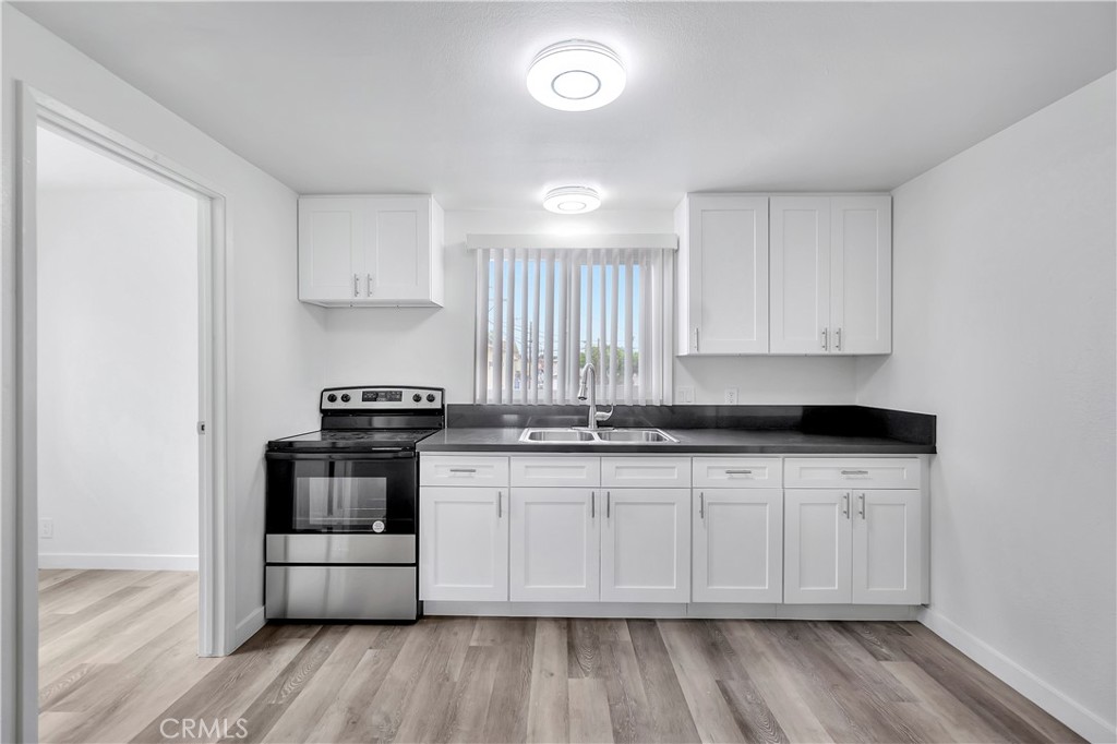 1813 West Ball Road Anaheim, CA 92804 - Photo 26 of 36 a kitchen with stainless steel appliances a sink and a stove