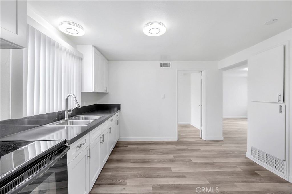 1813 West Ball Road Anaheim, CA 92804 - Photo 28 of 36 a kitchen with granite countertop a sink and a stove
