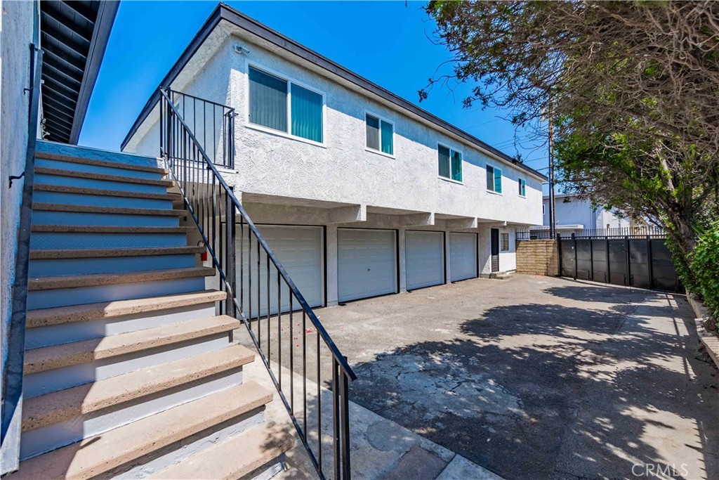 1813 West Ball Road Anaheim, CA 92804 - Photo 31 of 36 a view of house with wooden stairs and a large tree