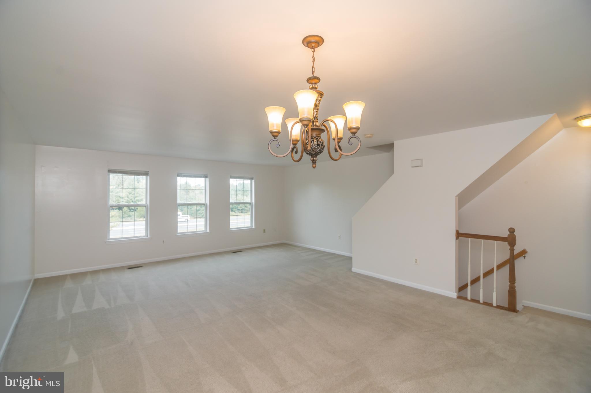 7311 Gateside Place Springfield, VA 22150 - Photo 18 of 30 a view of a chandelier and window in the room