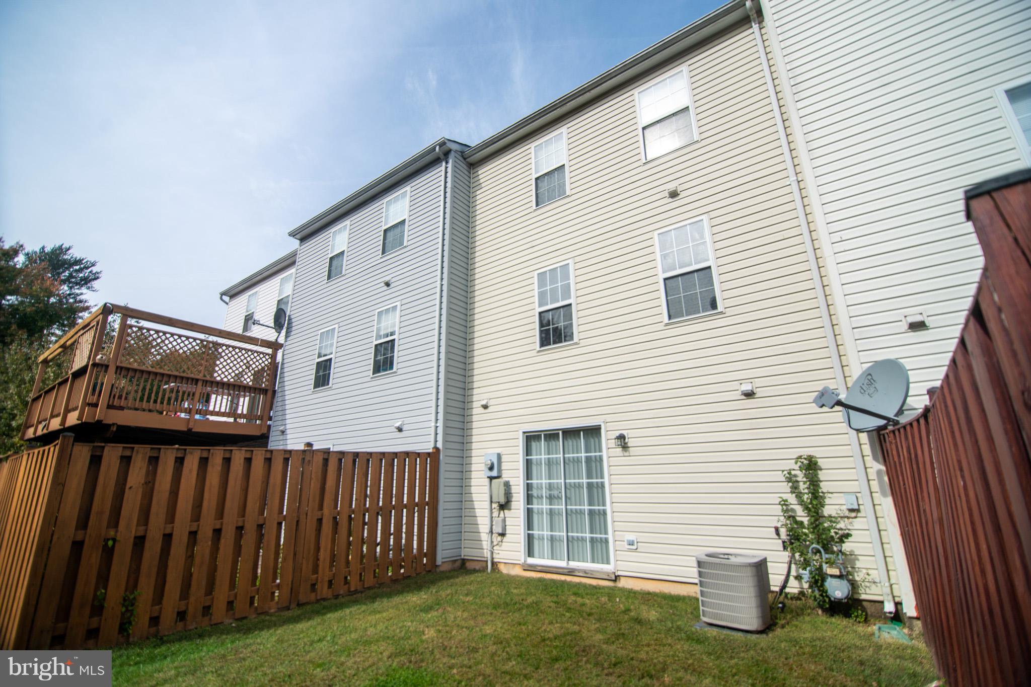7311 Gateside Place Springfield, VA 22150 - Photo 29 of 30 a view of a house with backyard and sitting area
