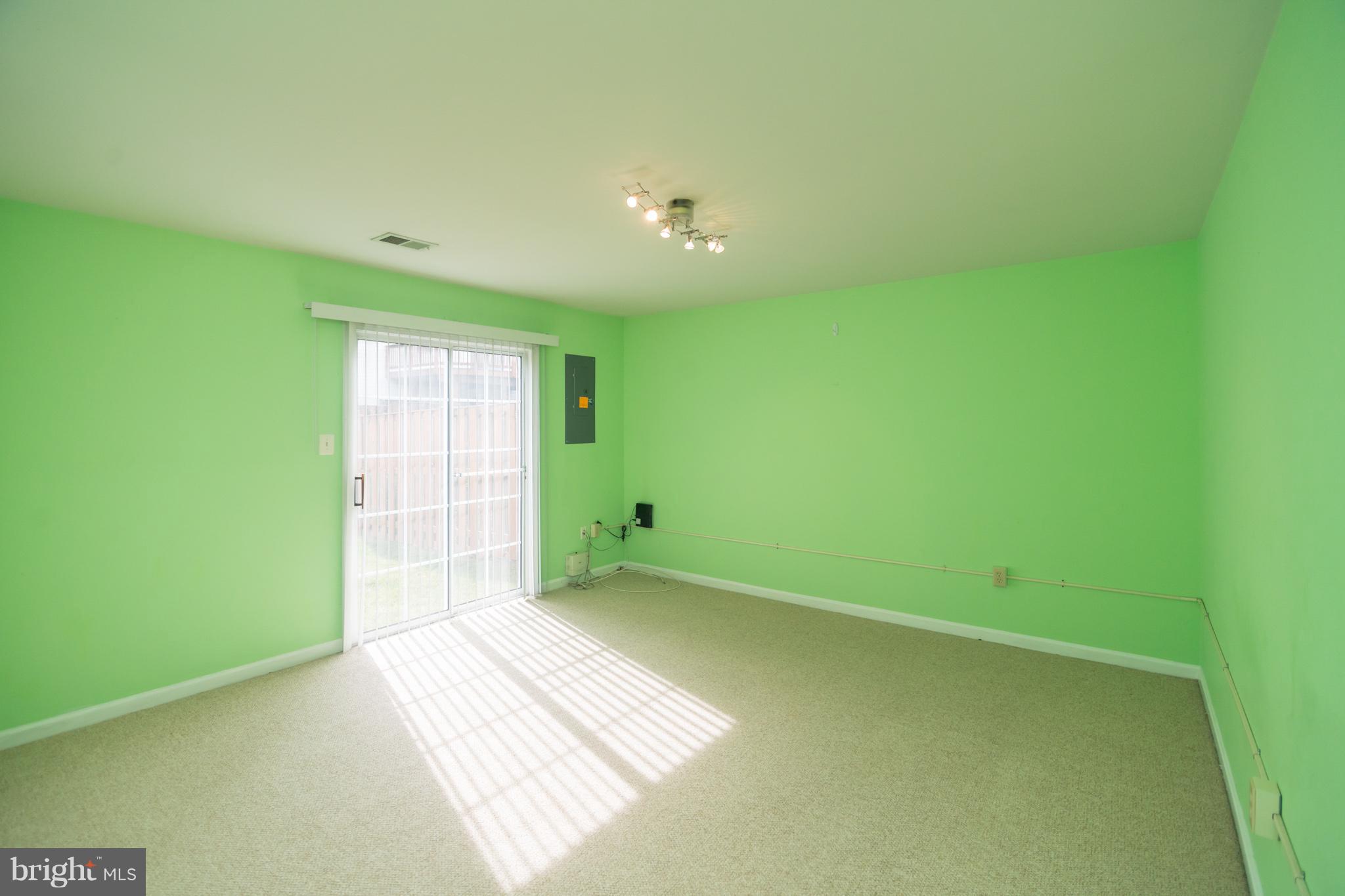 7311 Gateside Place Springfield, VA 22150 - Photo 9 of 30 a view of an empty room with a window