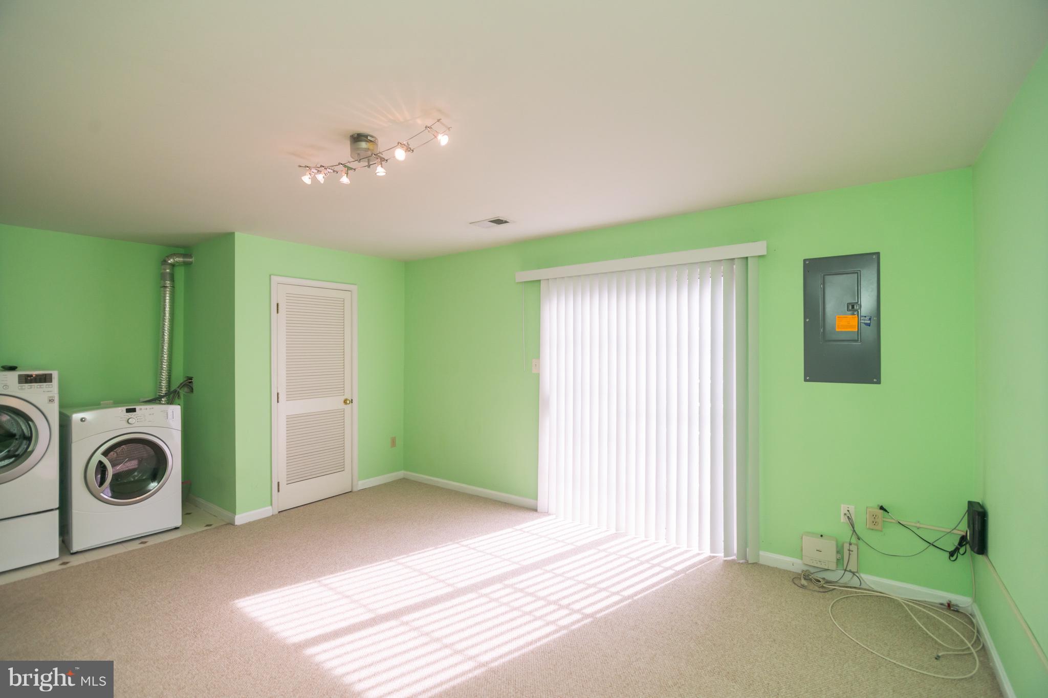 7311 Gateside Place Springfield, VA 22150 - Photo 10 of 30 a view of a room with washing machine and windows
