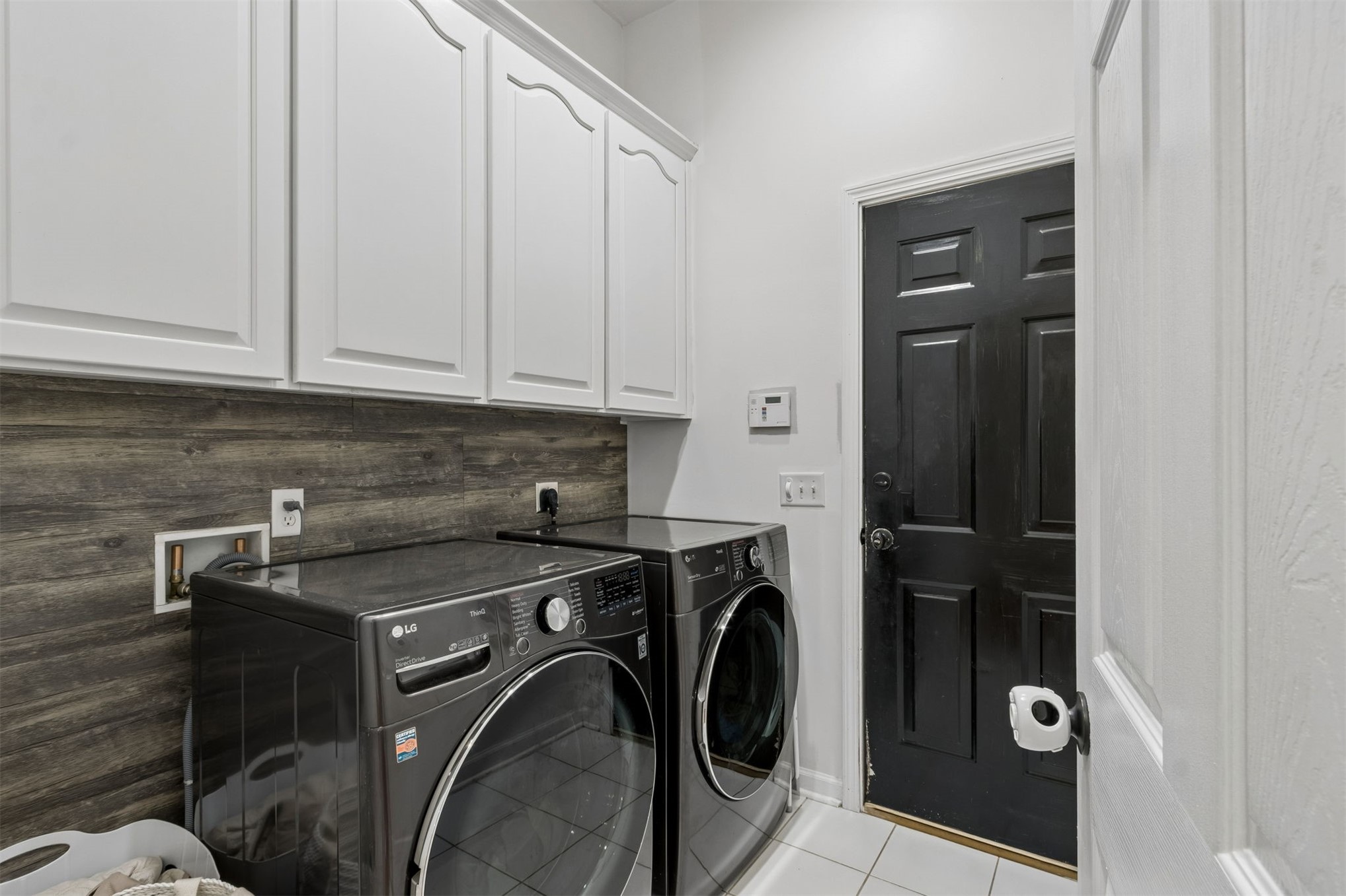 97070 Morgans Way Yulee, FL 32097 - Photo 41 of 69 laundry room with cabinets
